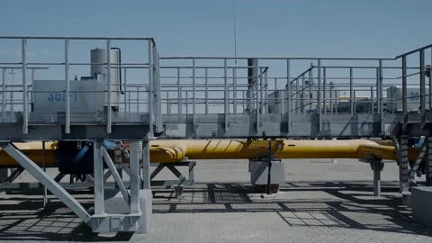 Metal structures of the factory on a background of blue sky Stock Footage 139267584