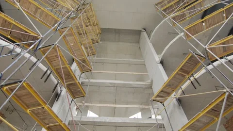 Metal structures in the middle of the building during construction. Construction Stock Footage 133765419