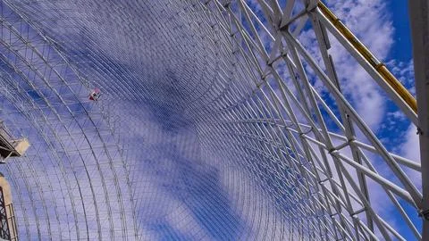 Metal structures in the process of being assembled in an industrial warehouse Stock Photos