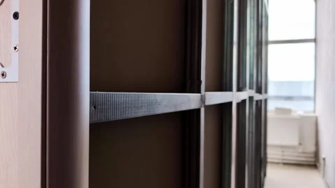 Metal stud framing installation for interior partition wall construction, Stock Footage 344845807