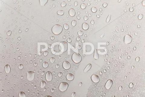 Metal surface covered in water drops. Stock Photos