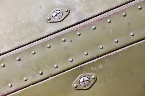 Metal surface with rivets Foto stock