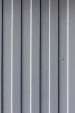 Metal surface vertical stripes pattern texture background Stock Photos