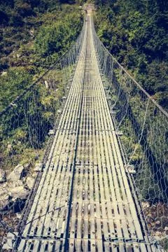 Metal suspension bridge. Stock Photos