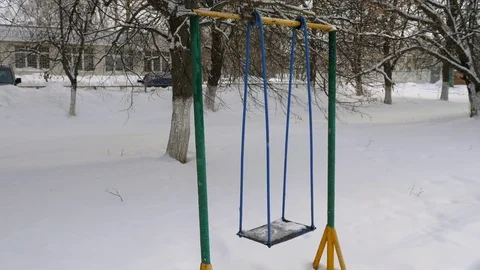 Metal swing in the snow. Stock Footage 87471926