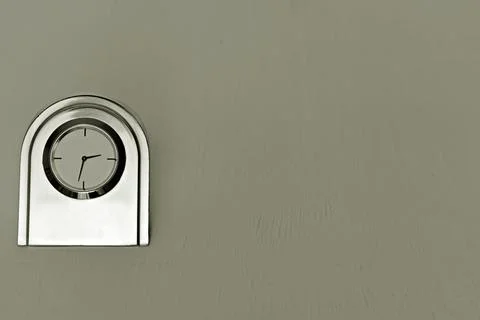 Metal table clock with primitive face Stock Photos