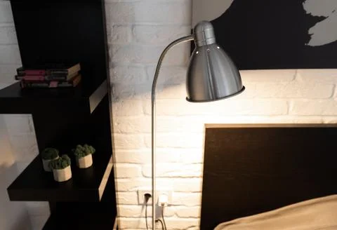 Metal Task Lamp with an adjustable reading light. Steel downbridge floor lamp Stock Photos