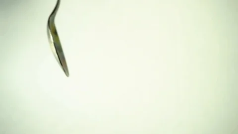 Metal teaspoon on white background. 2 Stock Footage 97876149