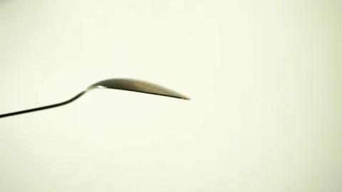 Metal teaspoon on white background. 3 Stock Footage 97876151