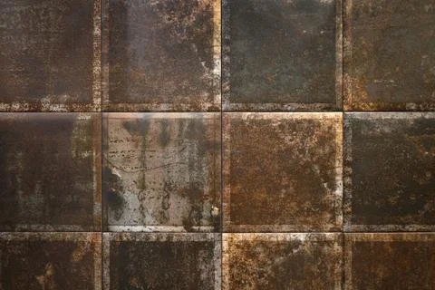 Metal tile with rust background. Rusty metal scale armor Stock Photos