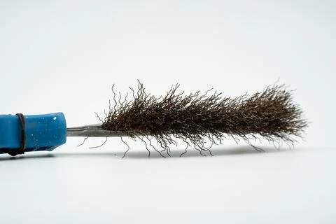 Metal -tipped brush to remove rusts and dirt close up Stock Photos