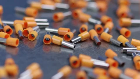 Metal tips with a plastic base for mounting on stranded copper wires. Stock Footage 340428242