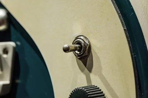 Metal Toggle Switch on Textured Panel with Vintage Aesthetic Stock Photos