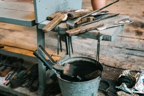 Metal Tools Laid Out to Process Molten Glass Stock Photos