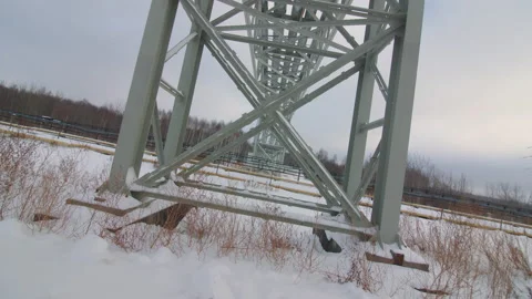 Metal tower support of pipeline construction on snowy field 库存影片 218620095