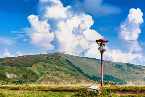 Metal track pointer on the road in the Carpathian mountains. 写真素材