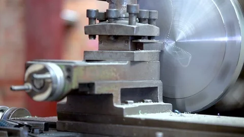 Metal trade. Milling machine operator working. Zoom out of turning lathe in a Stock Footage 88429385