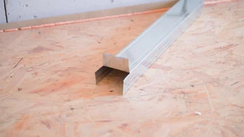 Metal U-profile cut to size for a frame wall. Universal galvanized reinforced Stock Footage 245274425