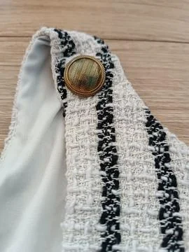 Metal washed old button on a washed cloth dress old washed clothes Stock Photos