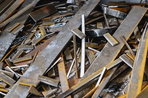 Metal waste after processing and cutting metal at the factory in the workshop Photos