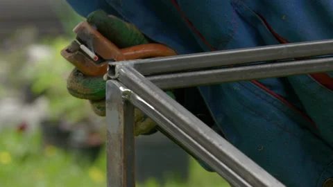 Metal Welder Working With Welding Machine To Weld Metal Construction With Bright Stock-Footage 143345386