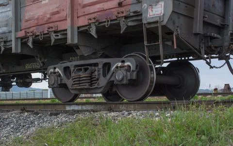 Metal wheels of a cargo train Stock Photos