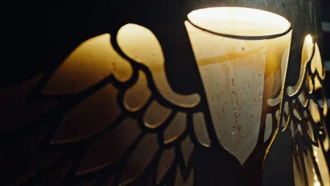 Metal wings engraved bar interior closeup. Carved feathers reflecting soft light Stock Footage 334003370