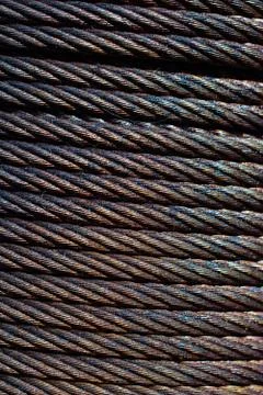 Metal wire roll close-up. Pattern of cables. Stock Photos