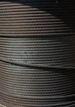 Metal wire roll close-up. Pattern of cables. Stock Photos