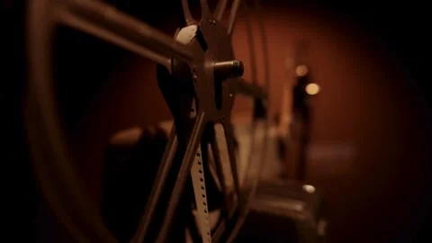 Metal wire unspools from large reel against blue sky 動画素材 329746147