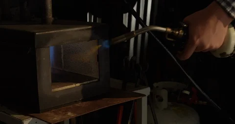 Metal worker lights forge oven Stock-Footage 120426758