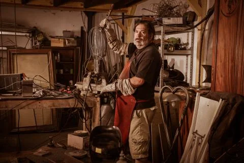 Metal worker standing in workshop Stock Photos