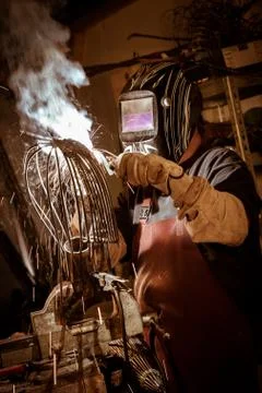Metal worker standing in workshop 스톡 사진