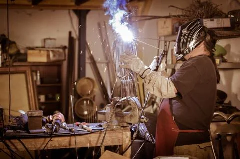 Metal worker standing in workshop Stock Photos