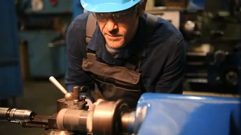 Metal worker using machine in workshop Stock Footage 59787652