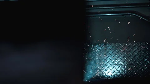 Metal worker welding in dark work shop - high contrast slow motion Stock Footage 168464650
