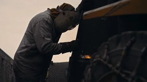 Metal worker welding in dark work shop - high contrast slow motion Vídeos de archivo 168464904