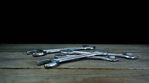 Metal wrenches falling in slow motion Stock Footage 134180278