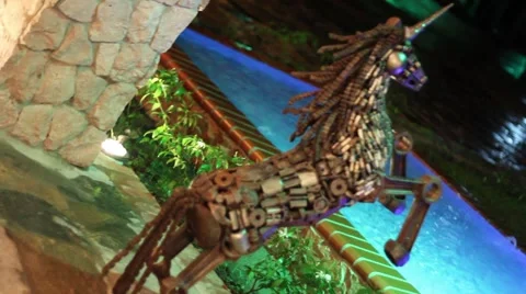 Metalic unicorn statue pool Stock Footage 974976