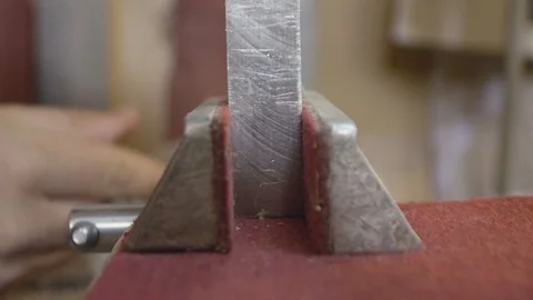 Metall block in vise Stock Footage 70812110