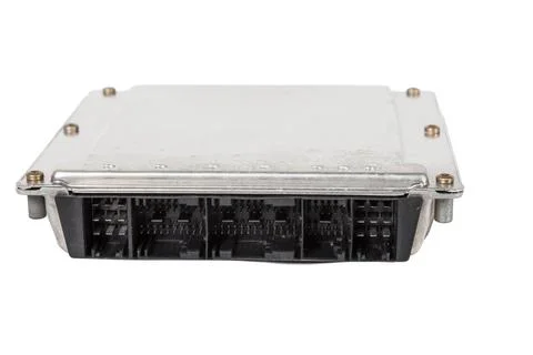 A metall car engine control unit with metal elements on a white isolated back Stock Photos