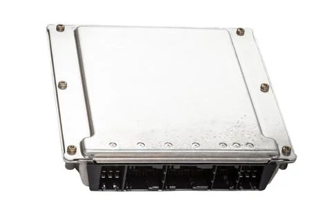 A metall car engine control unit with metal elements on a white isolated back Stock Photos