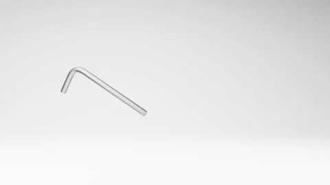 Metallic Allen Key Spinning on Studio Light Gray Background Stock Footage 236225388