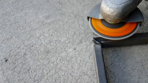 Metallic article and grinding wheel, close up Stock Footage 118142254