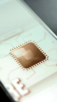 Metallic artificial intelligence processor connected to fine circuit traces Stock Photos