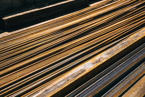 Metallic bars. Profile pipe and steel rods for the concrete reinforcing lies  Stock Photos