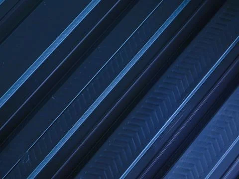 A metallic black background with parallel lines, creates high-tech concept Stock Photos