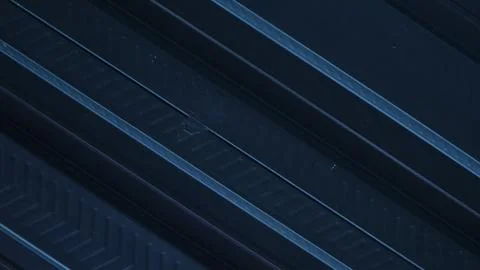 A metallic black background with parallel lines, creates high-tech concept Stock Photos