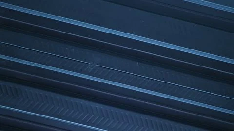 A metallic black background with parallel lines, creates high-tech concept Stock Photos