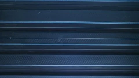 A metallic black background with parallel lines, creates high-tech concept Stock Photos
